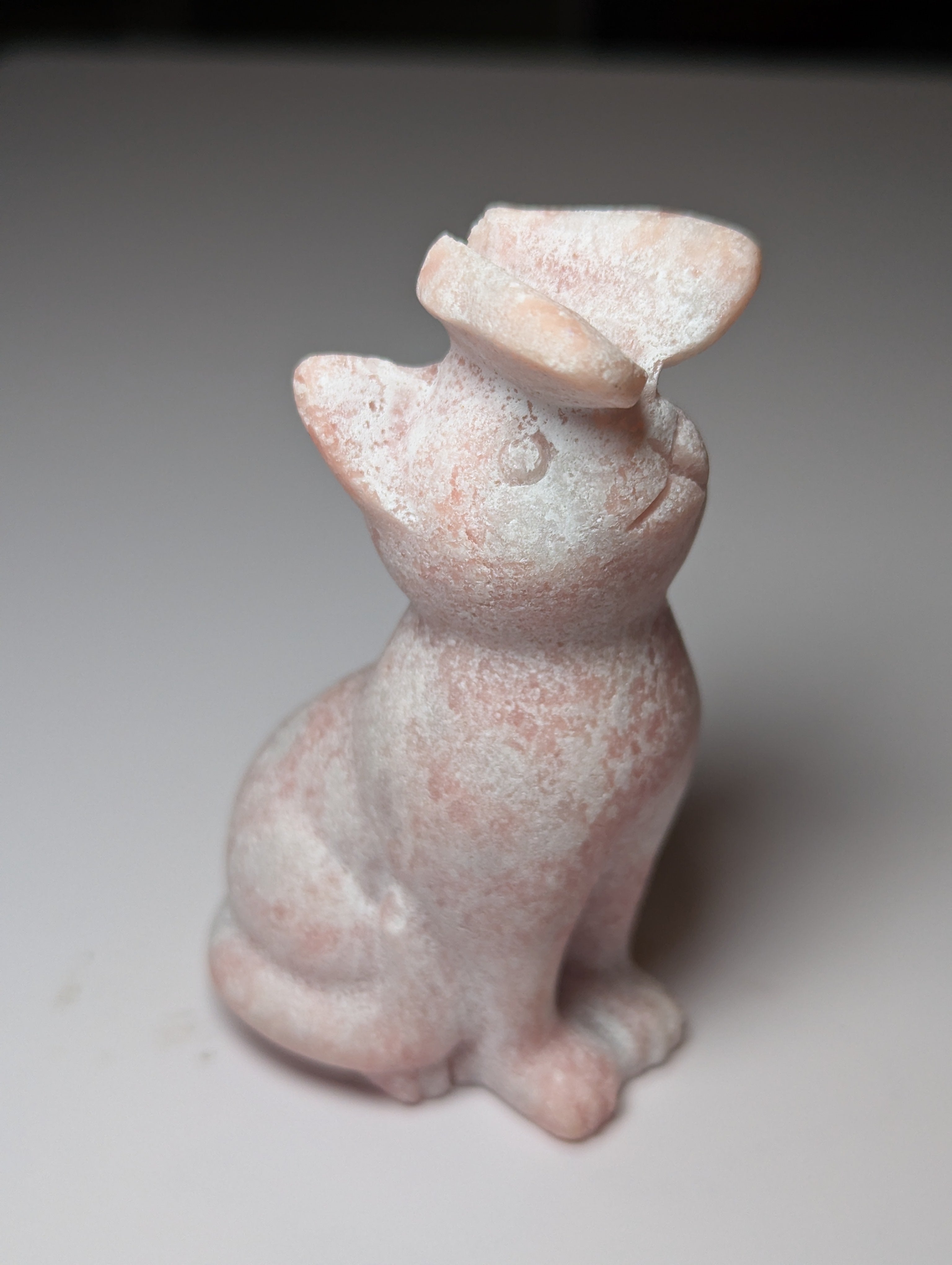 Pink opal cat with butterfly carving