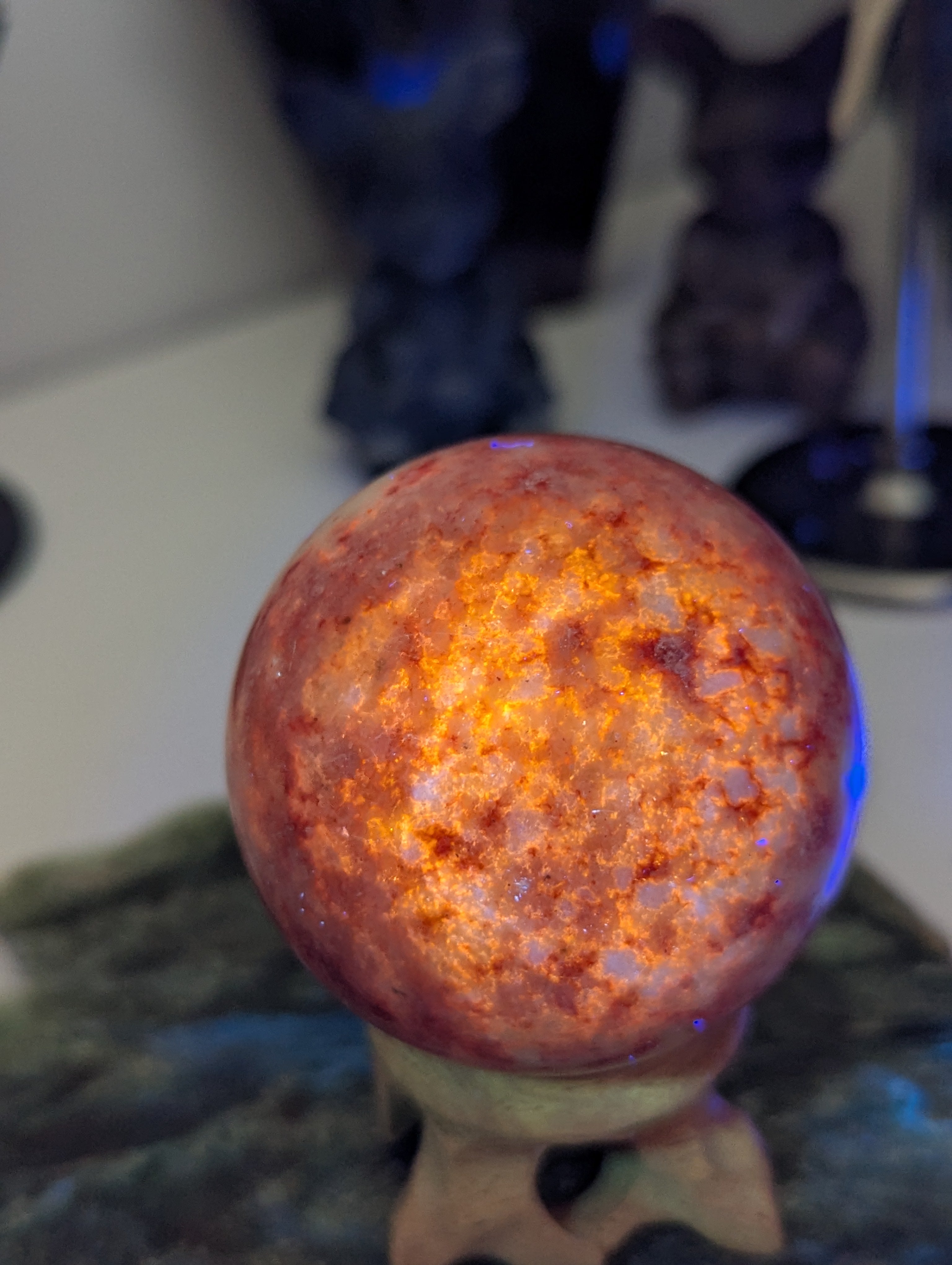 Pink Zoiltie crystal sphere with Orange UV