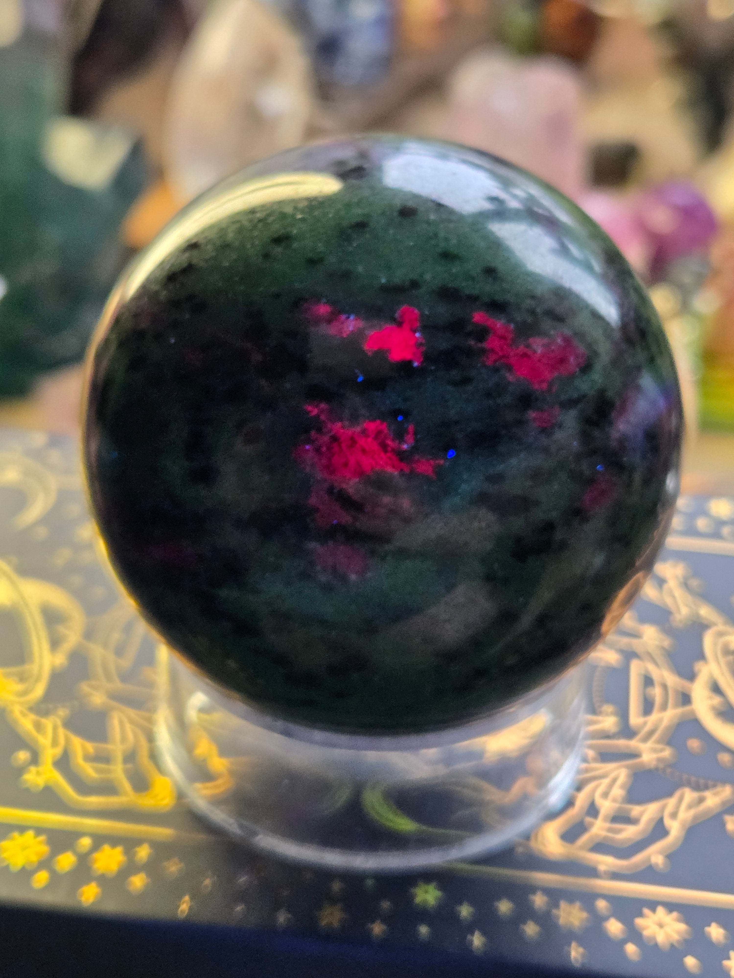 Ruby in zoisite crystal sphere carving