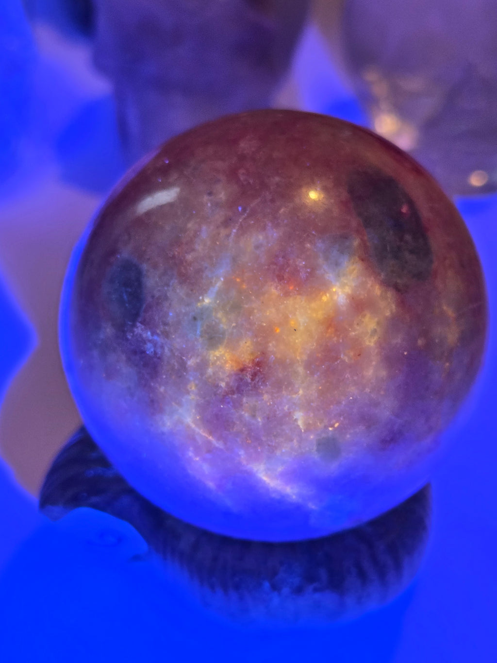 Pink zoisite crystal sphere carving with UV and comes with Stand