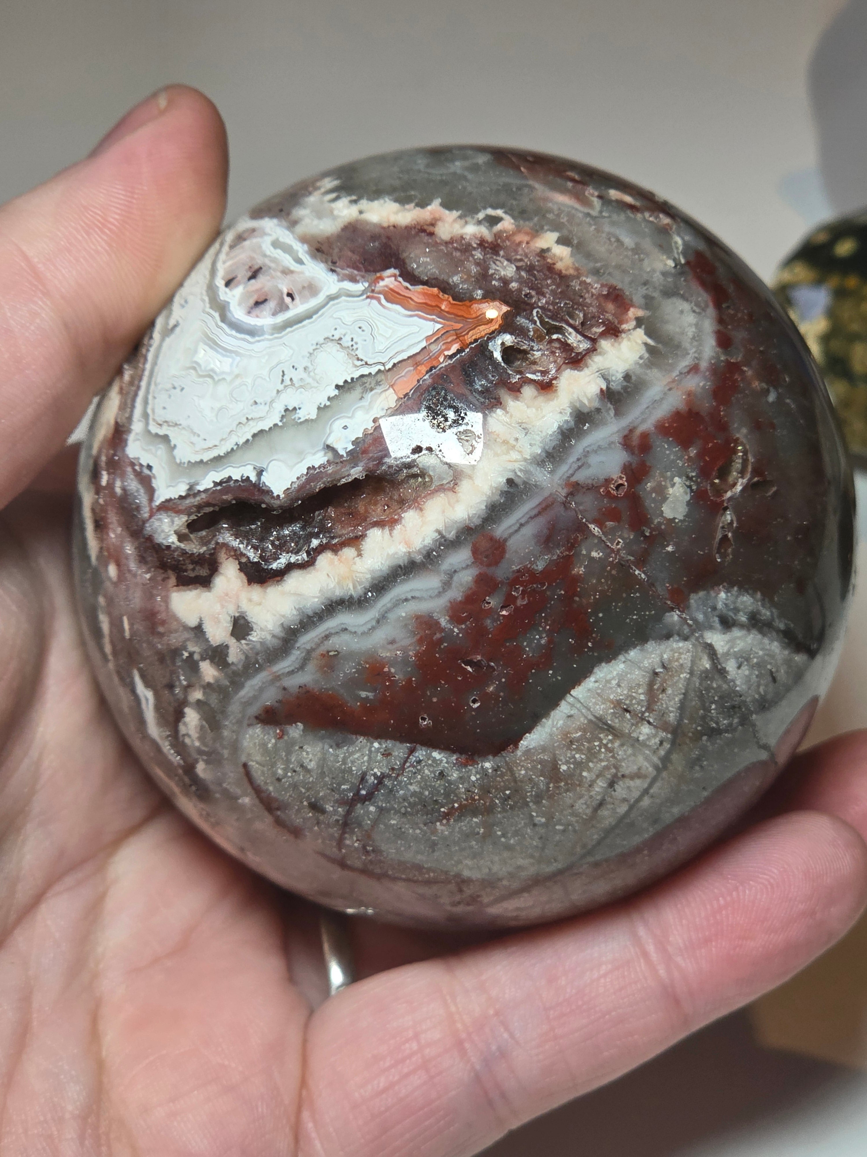 Mexican crazy lace agate crystal sphere  with imperfections