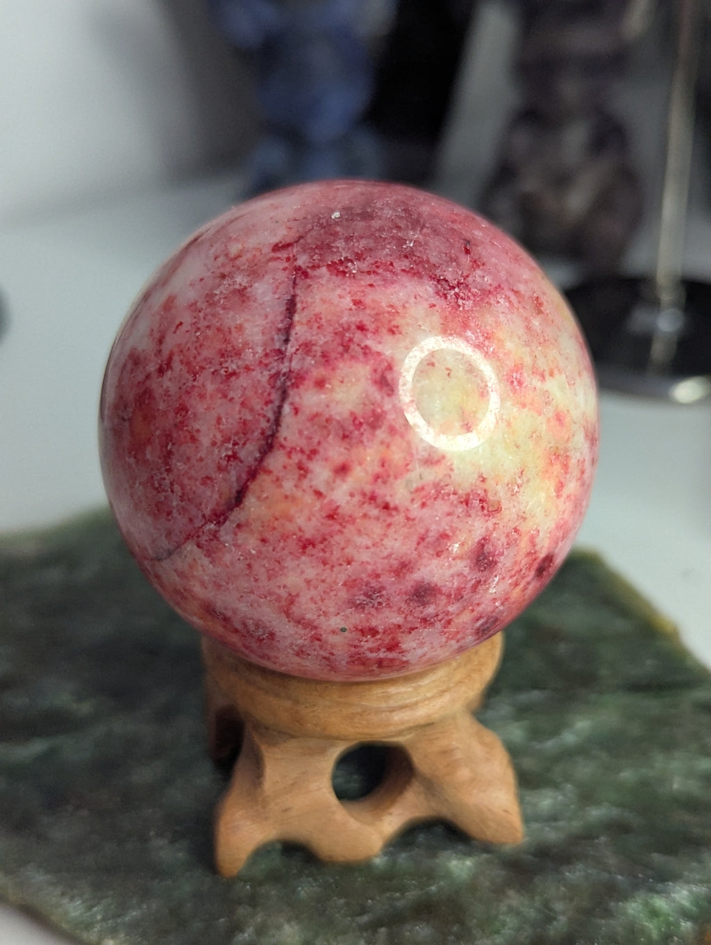 Pink Zoiltie crystal sphere with Orange UV