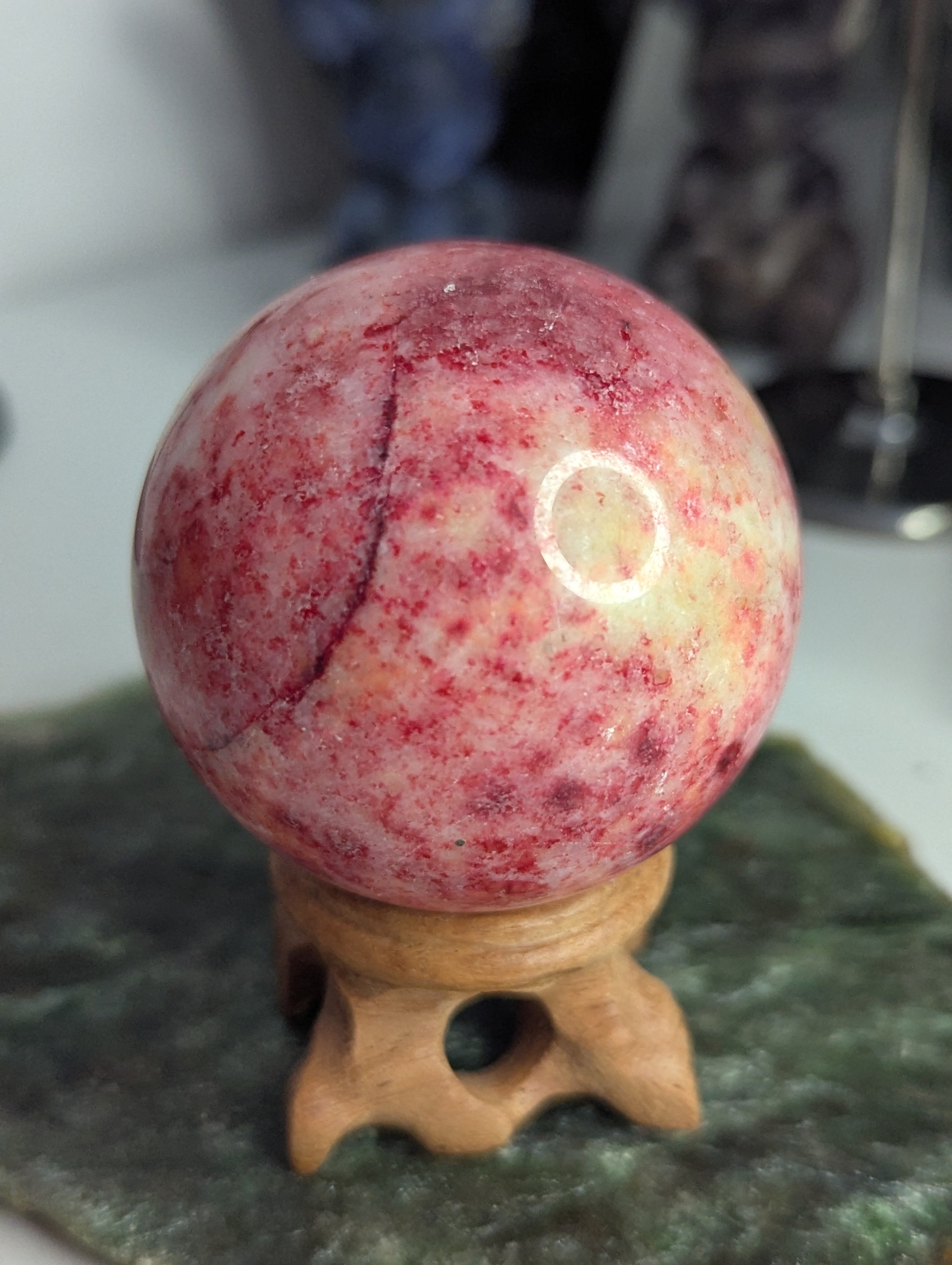 Pink Zoiltie crystal sphere with Orange UV