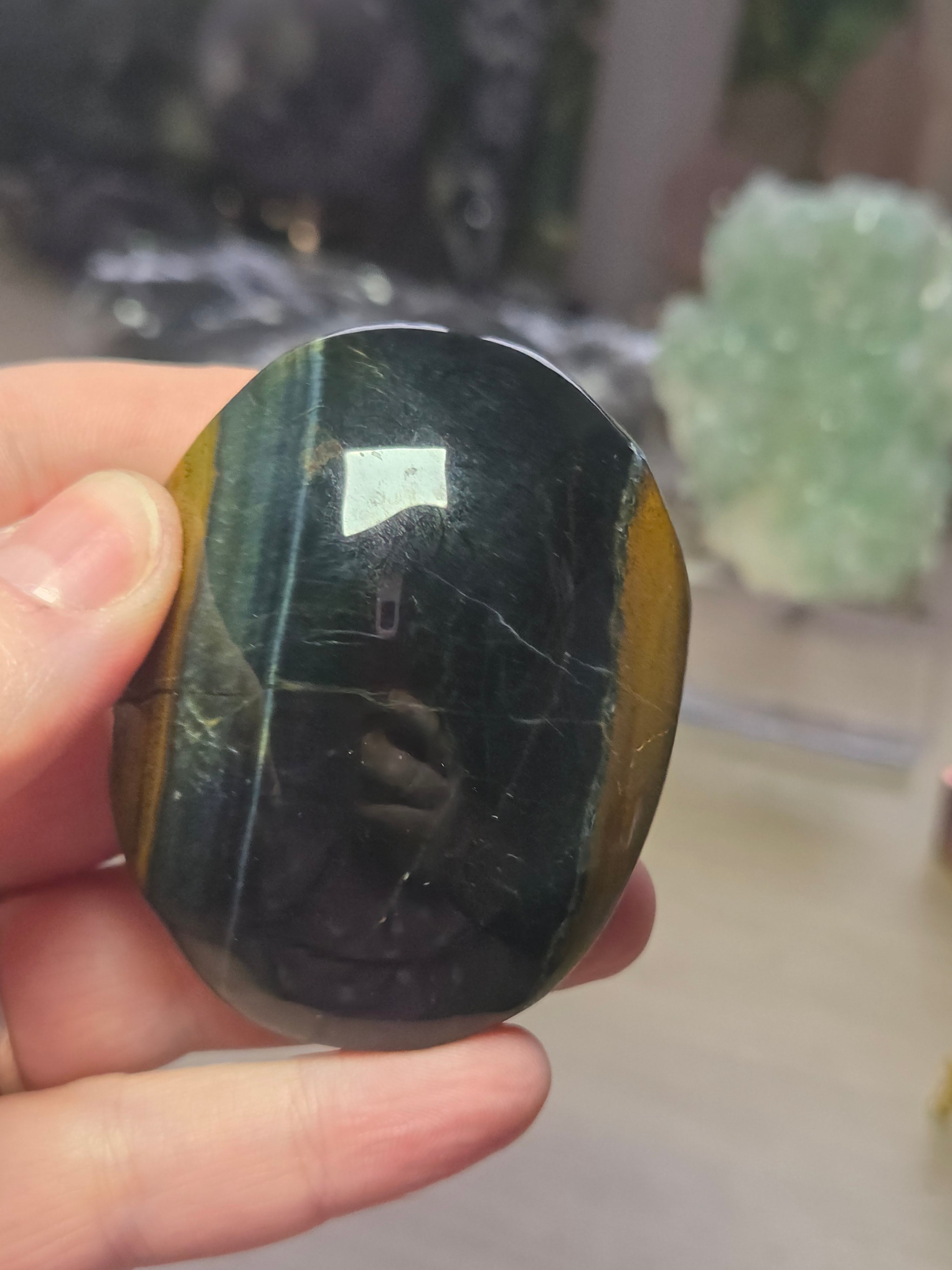 Tigers eye palm stone with Imperfections