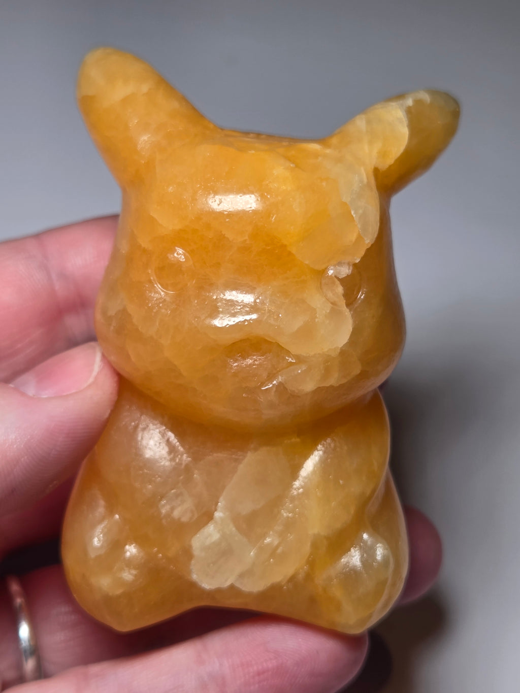 Orange calcite crystal pikachu pokemon carving