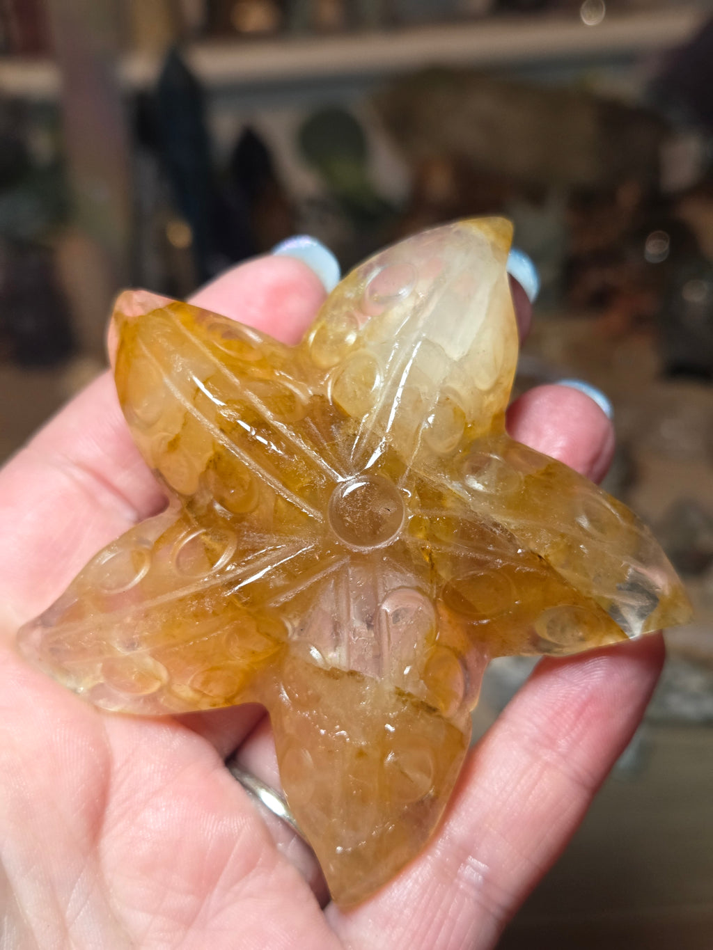 Golden healer star fish carving