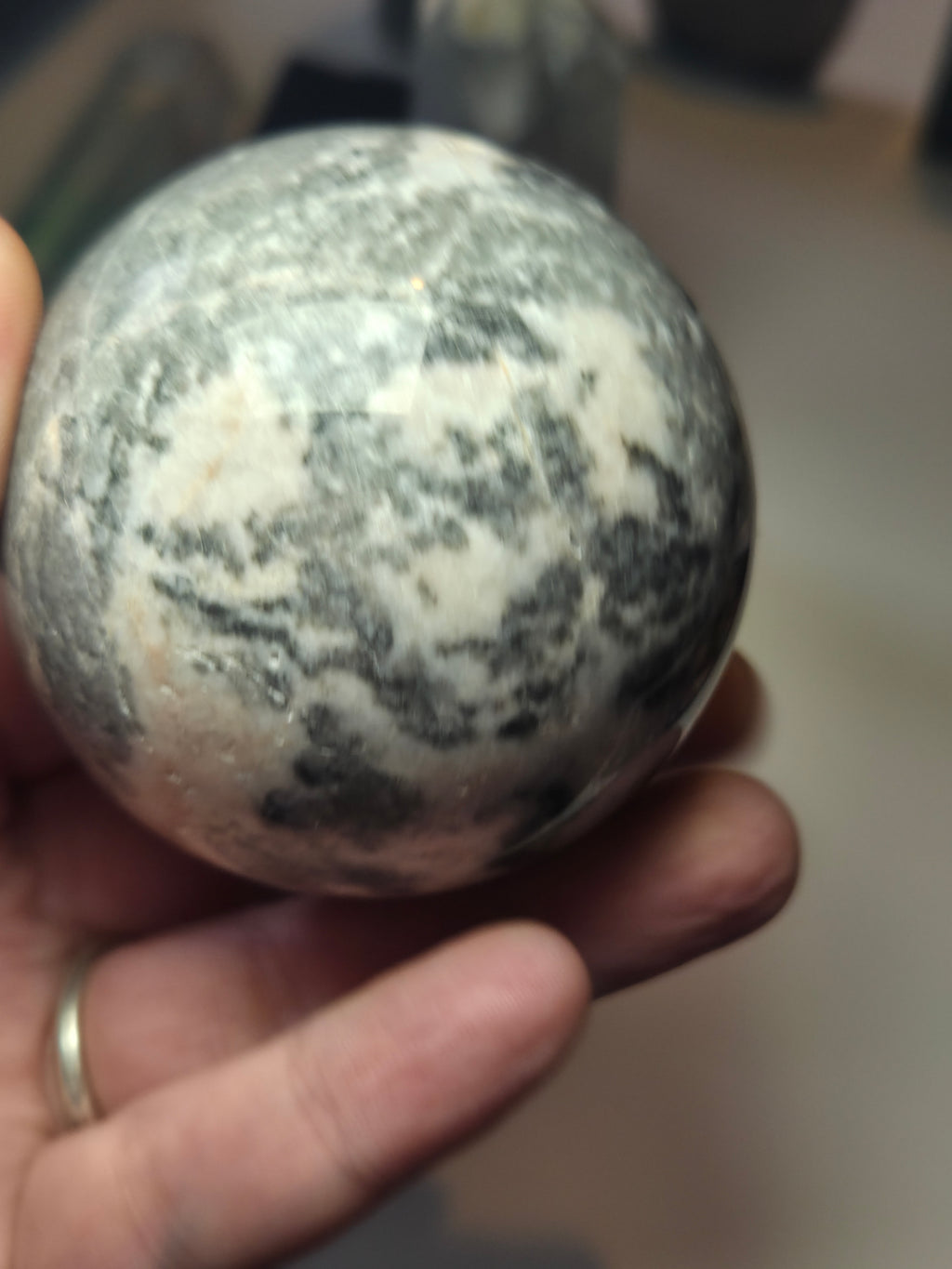 Pink rhodonite crystal sphere