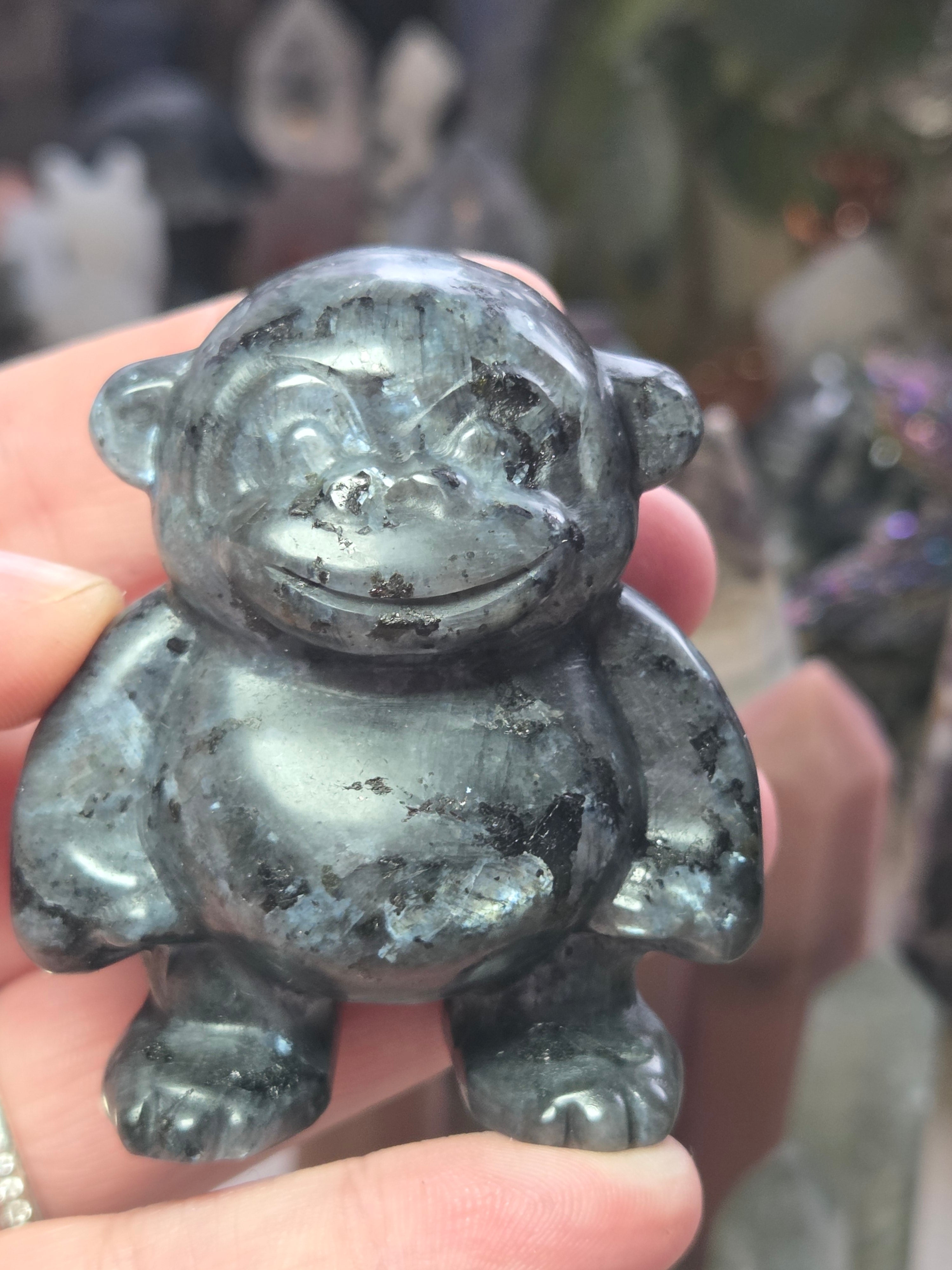 Larvakite crystal monkey carving
