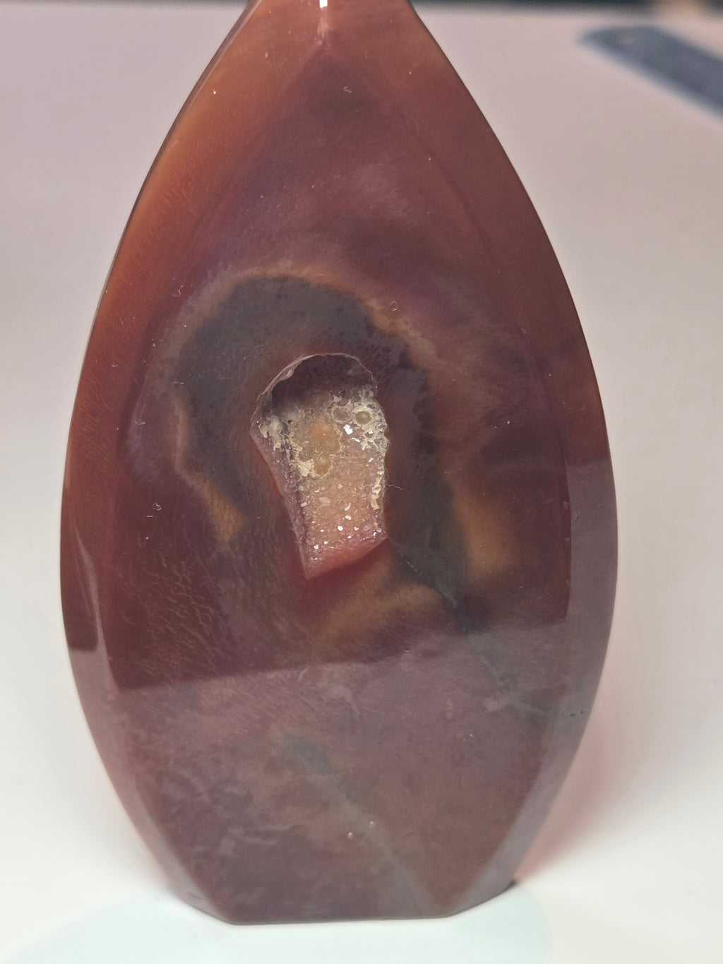 Carnelian crystal drop with imperfections