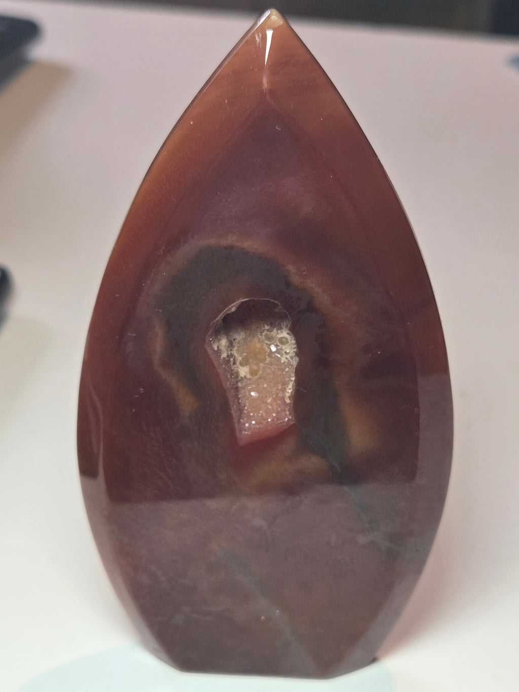 Carnelian crystal drop with imperfections