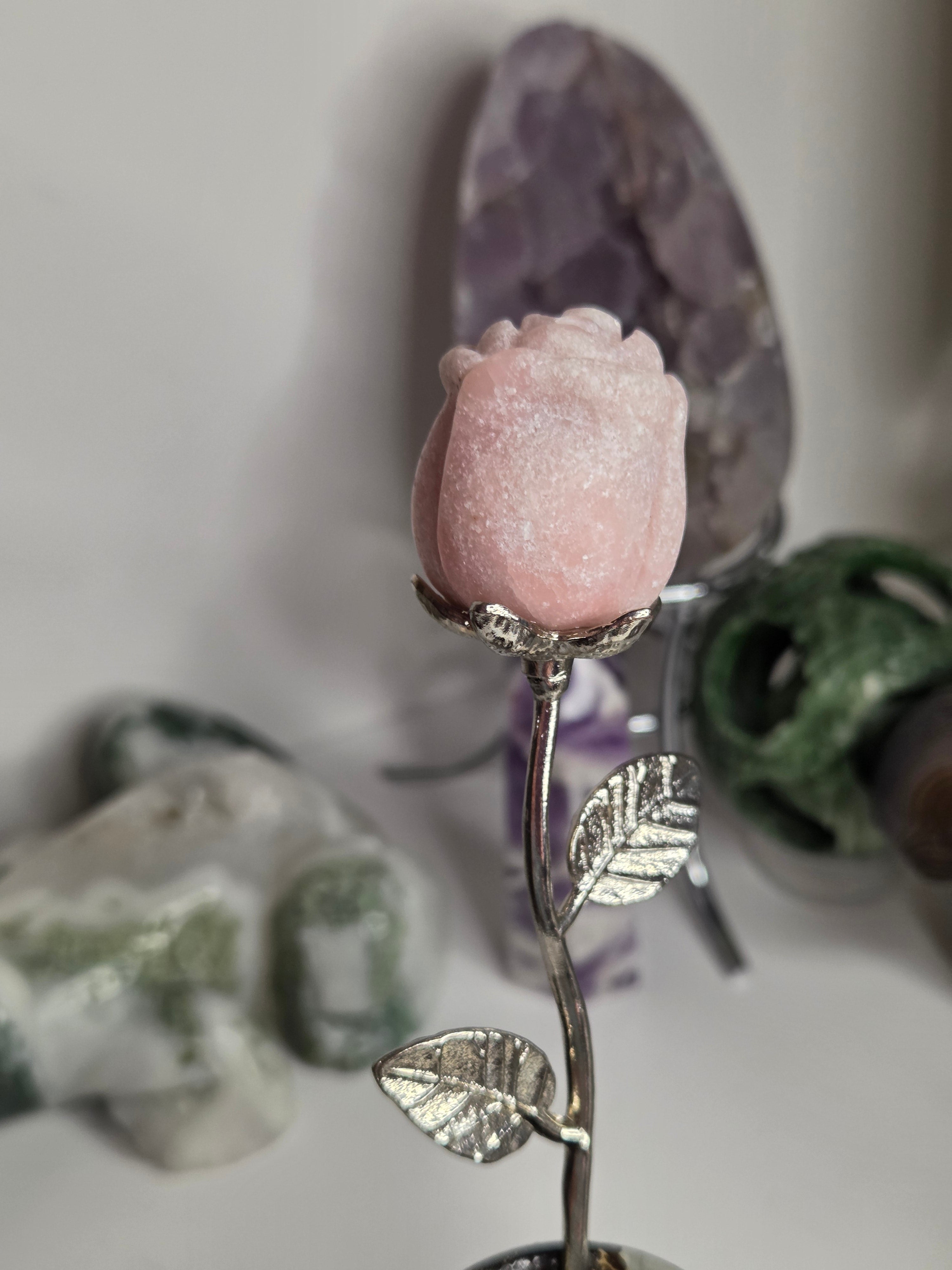 Pink opal crystal rose on stand