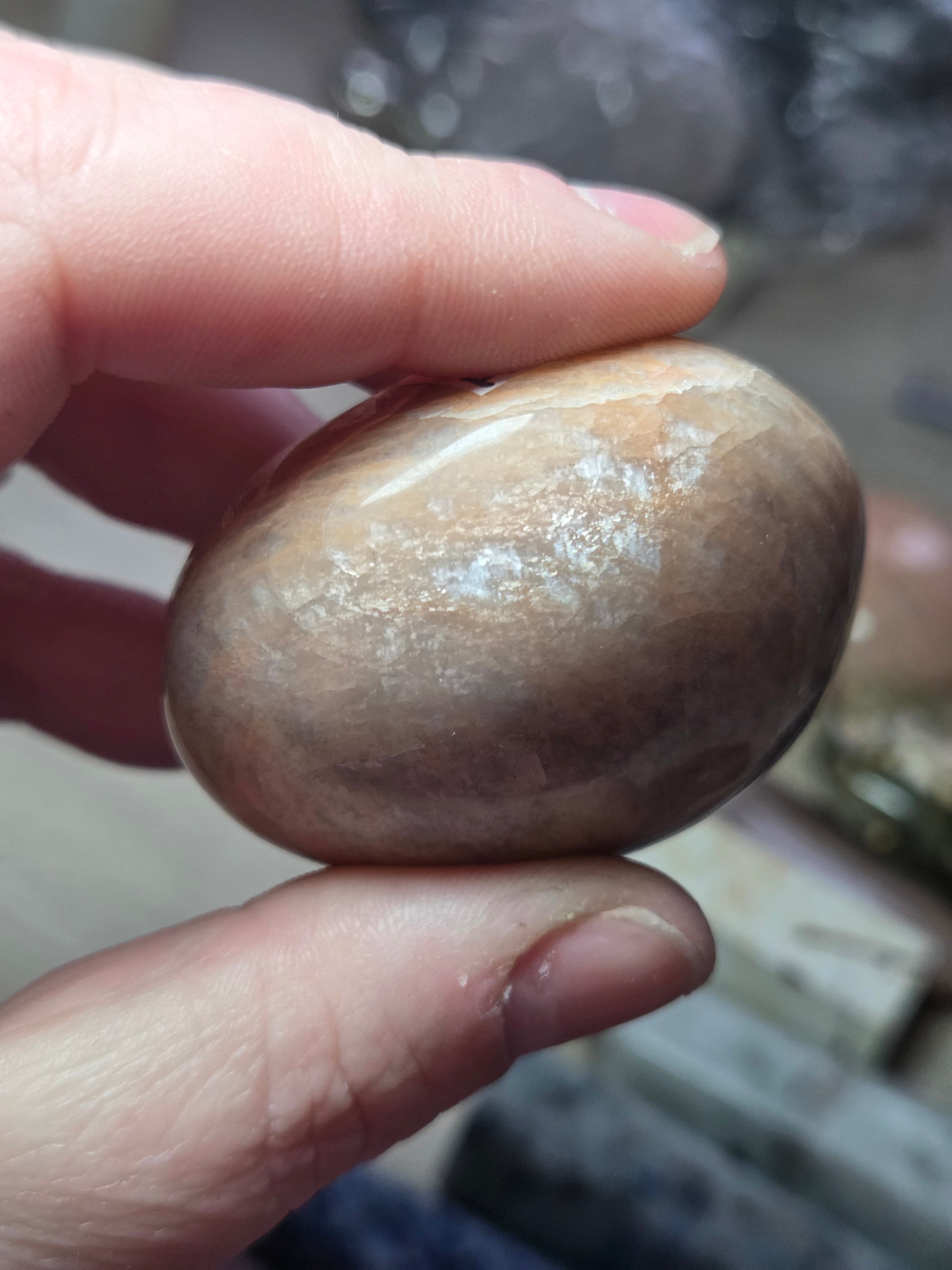 Peach moonstone crystal palm stone with imperfections