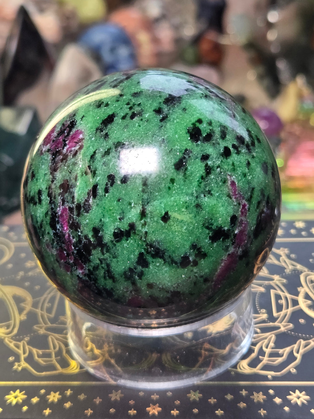 Ruby in zoisite crystal sphere carving