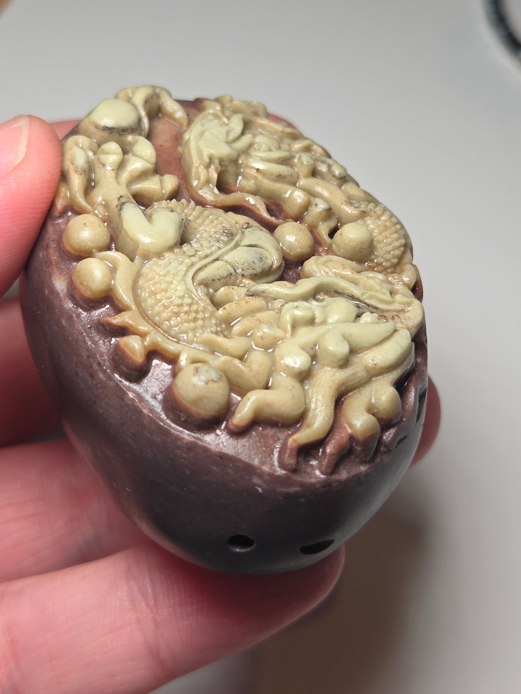 Handmade carved dragon palm stone in purple jade from Province