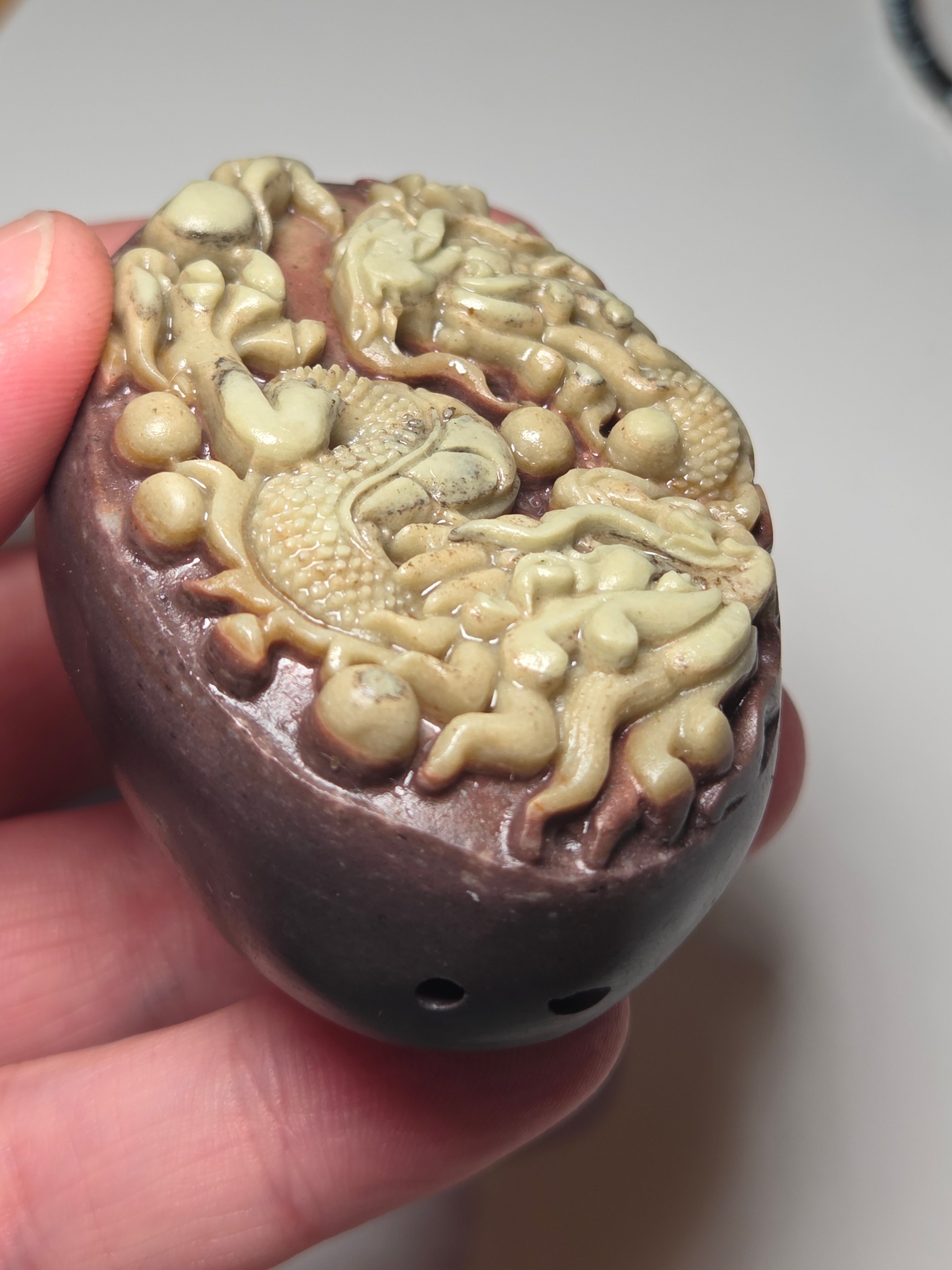 Handmade carved dragon palm stone in purple jade from Province