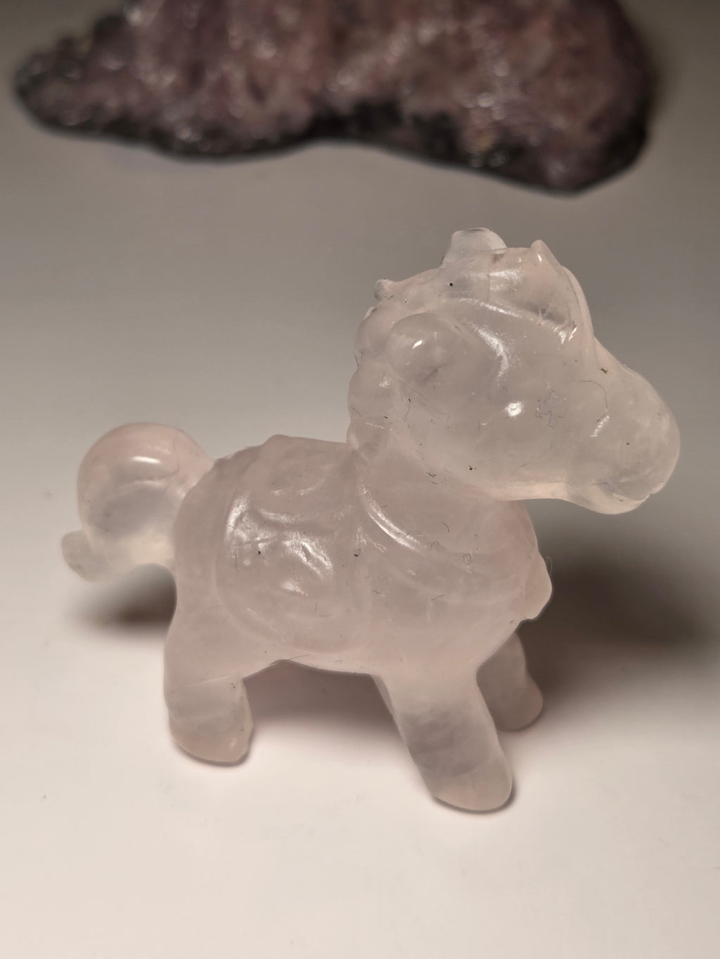 Rose quartz crystal horse carving
