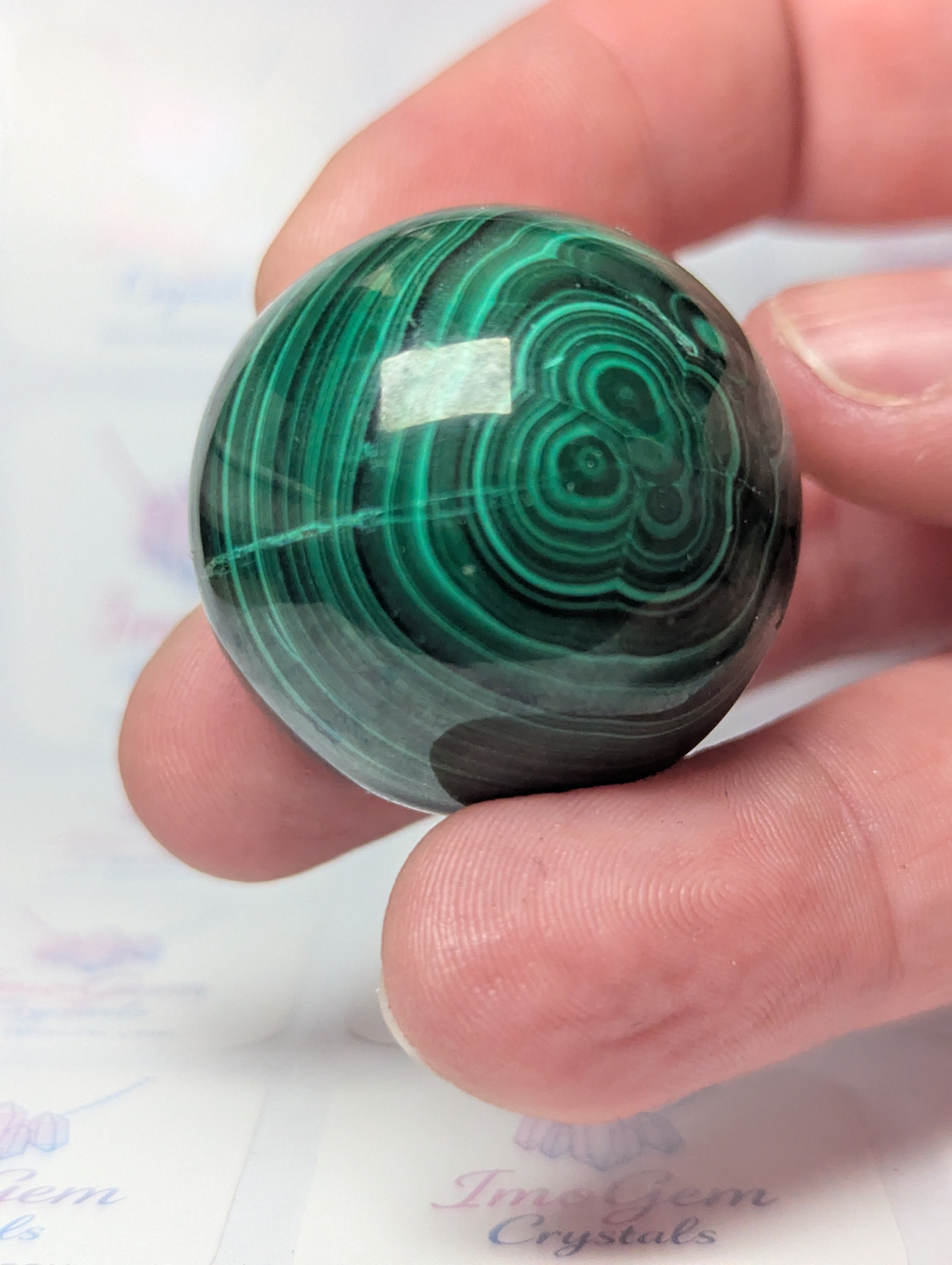 Malicite crystal sphere with imperfections