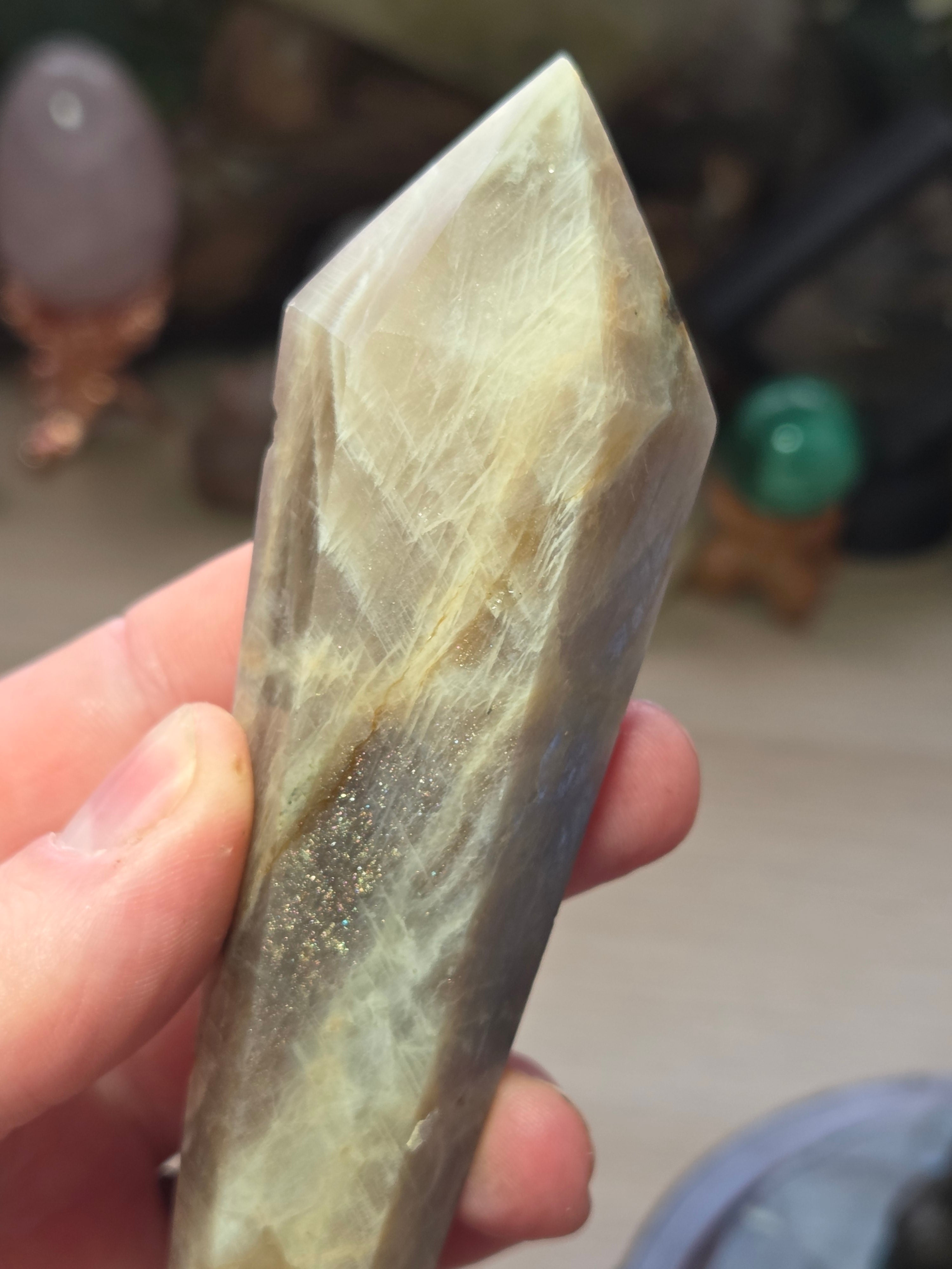 Rainbow moonstone and sunstone crystal wand carving with stand
