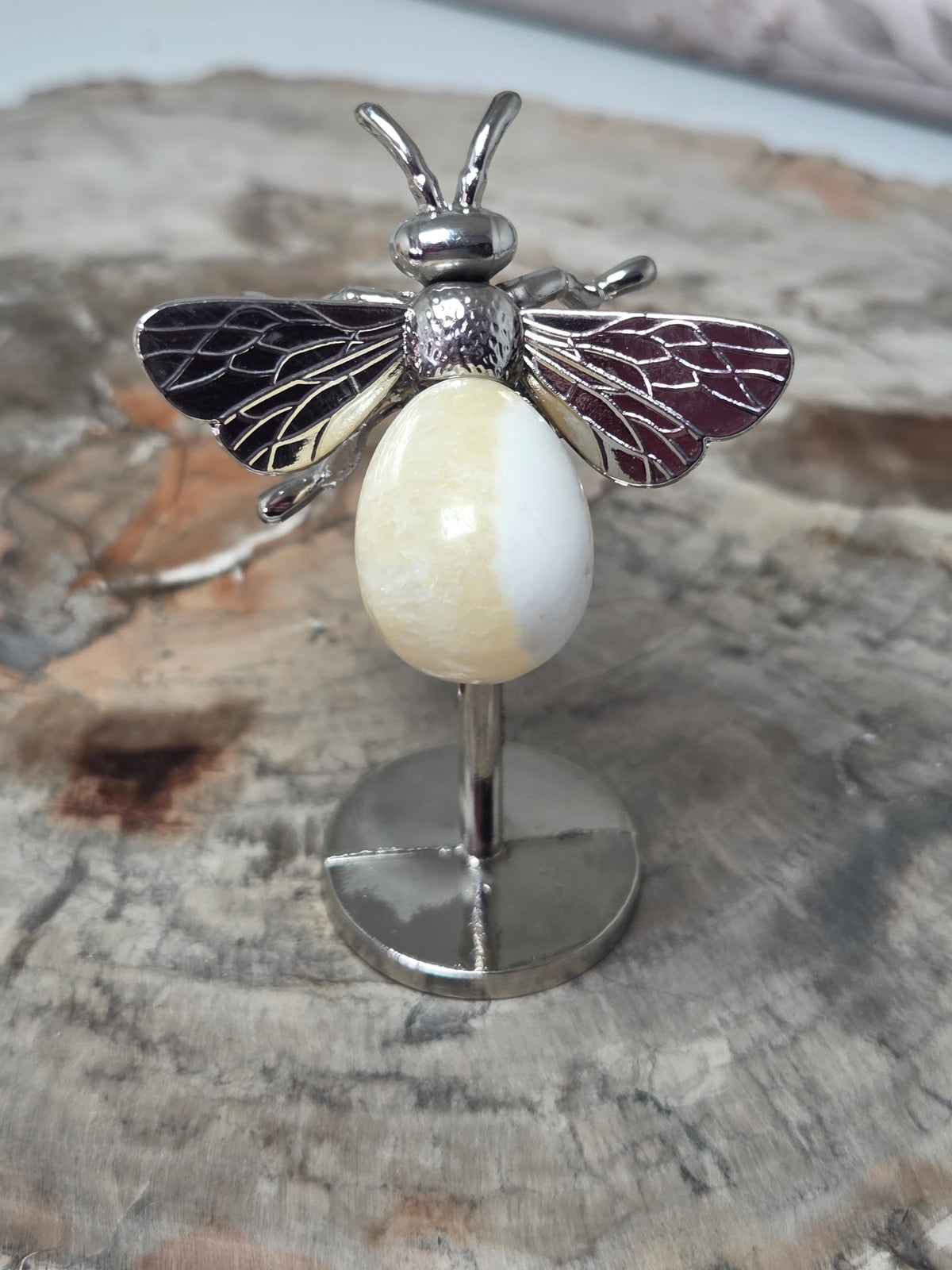 Orange calcite crystal bee carving