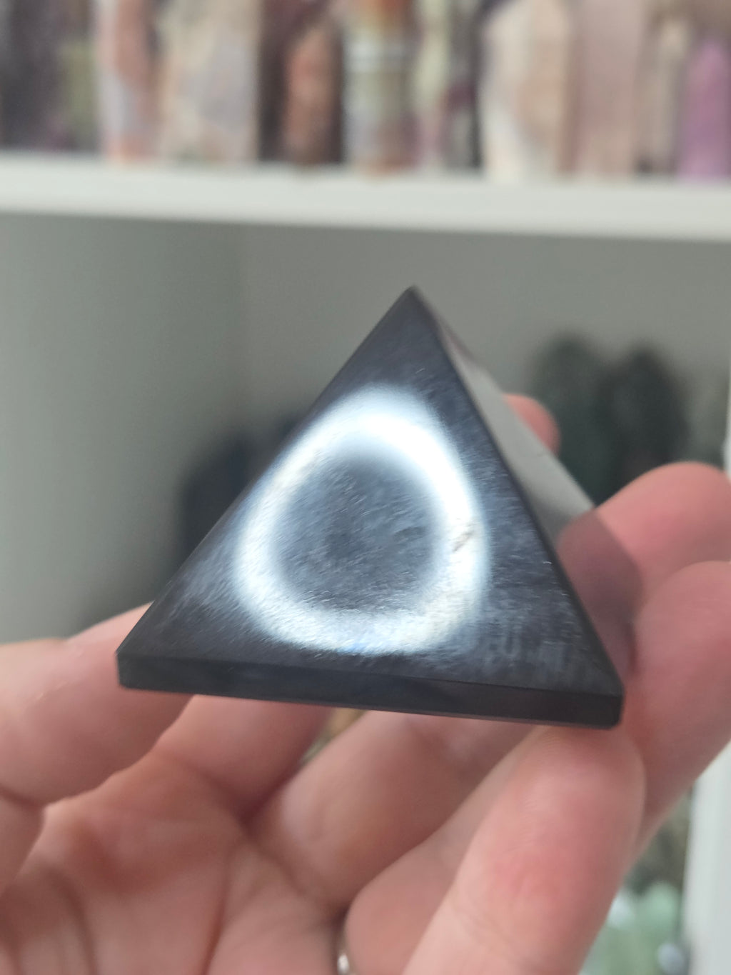 Black obsidian crystal pyramid carving