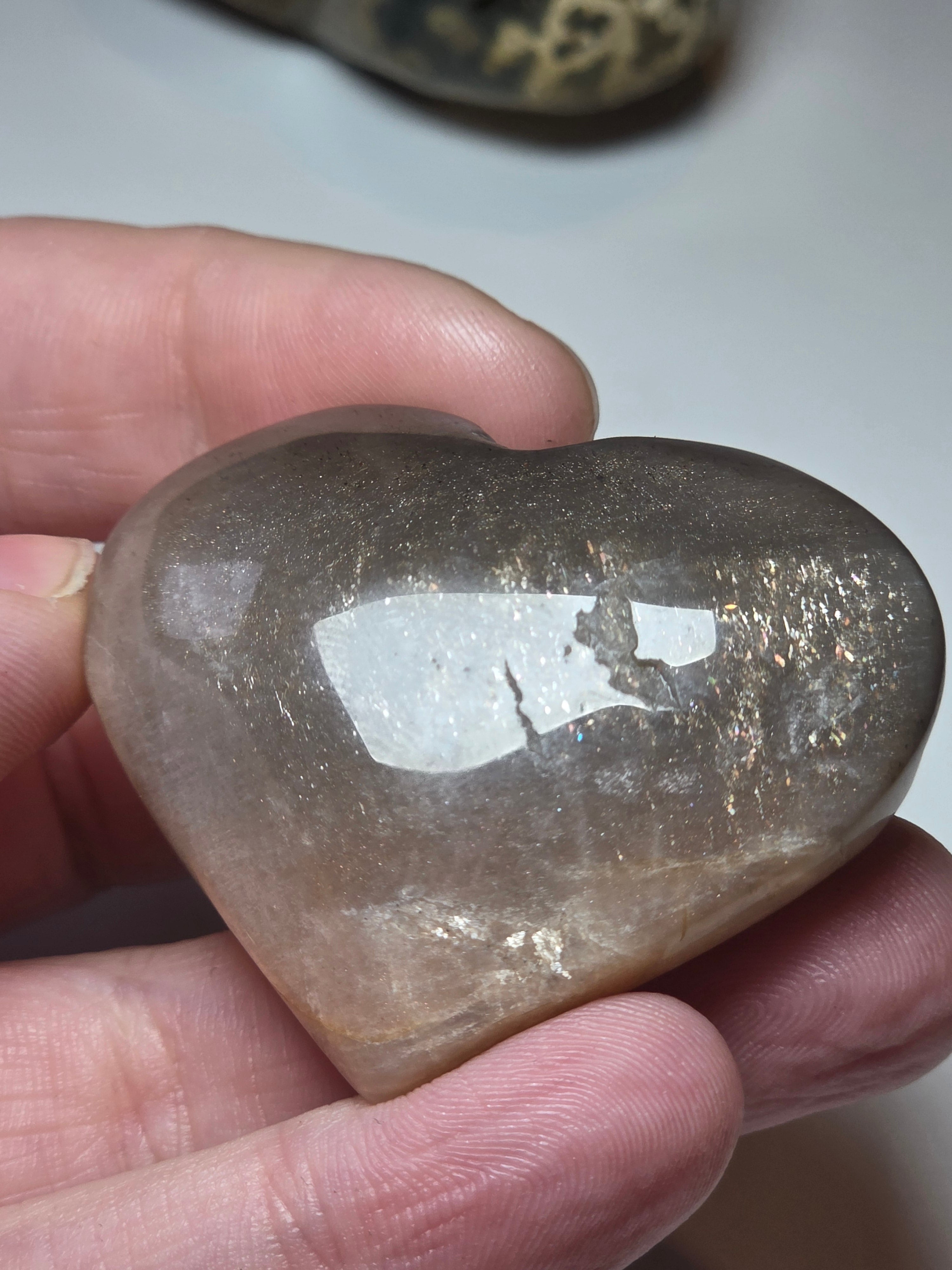 Sunstone and moonstone crystal heart carving with imperfections