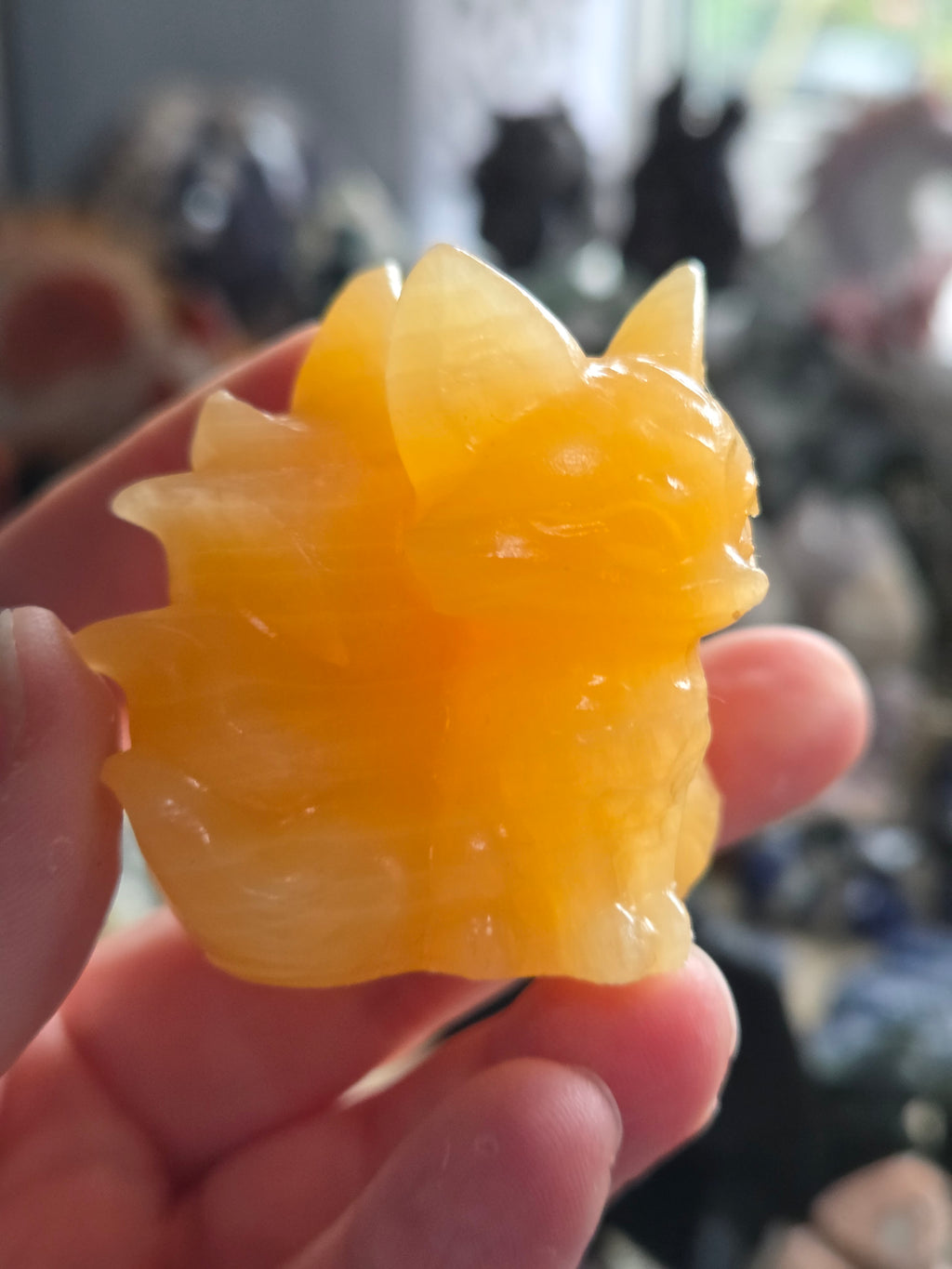 Orange calcite crystal nine tail fox