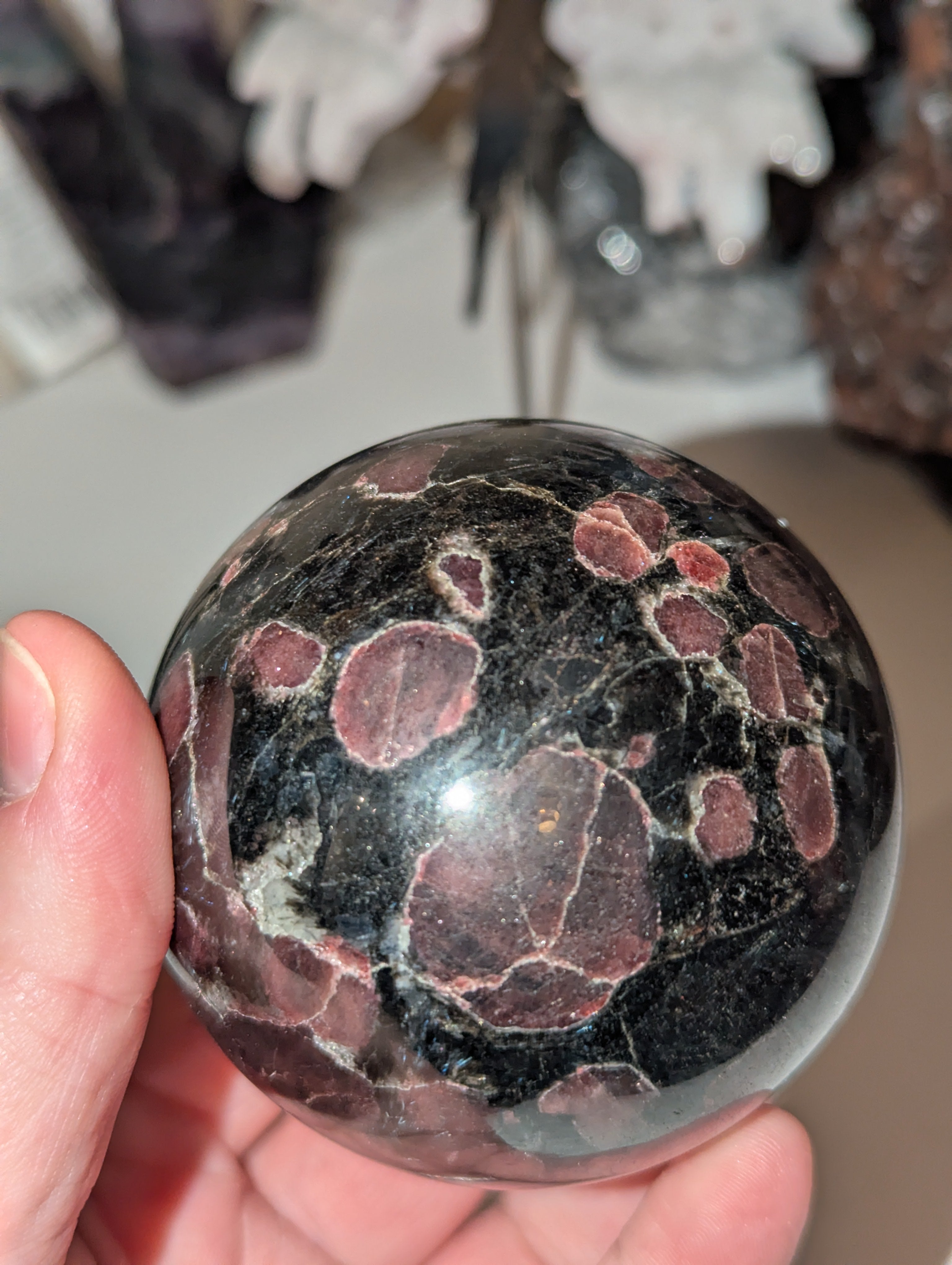 Astrophylite crystal sphere with garnet