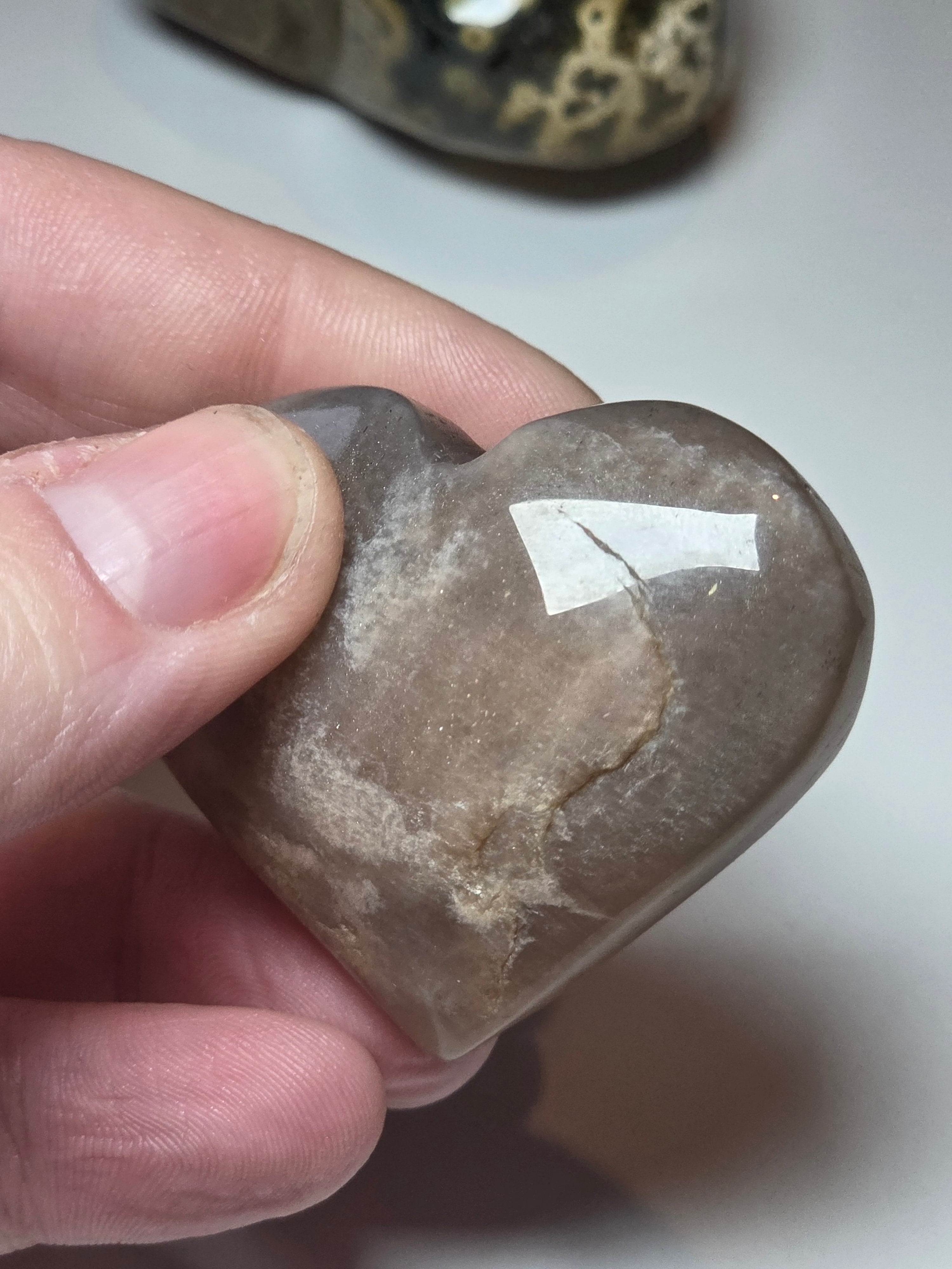 Sunstone and moonstone crystal heart carving with imperfections