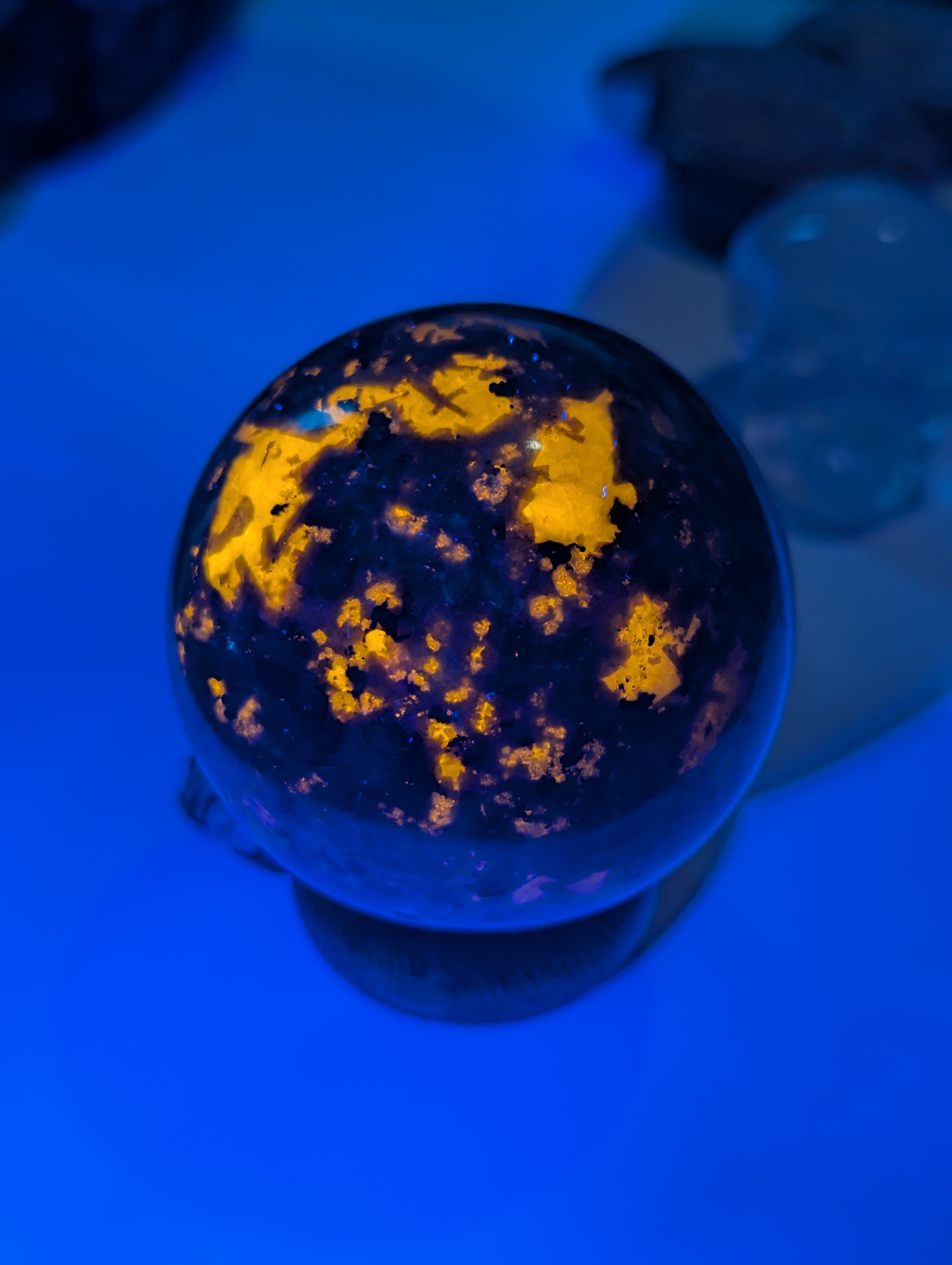 Yooperlite crystal sphere with Orange UV