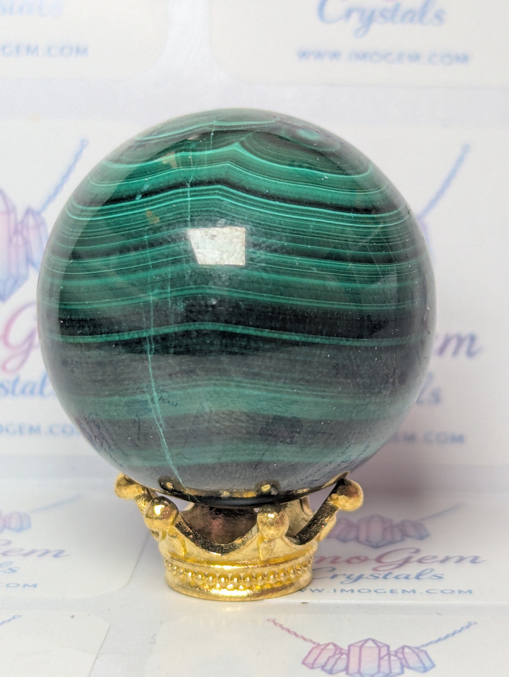 Malicite crystal sphere with imperfections
