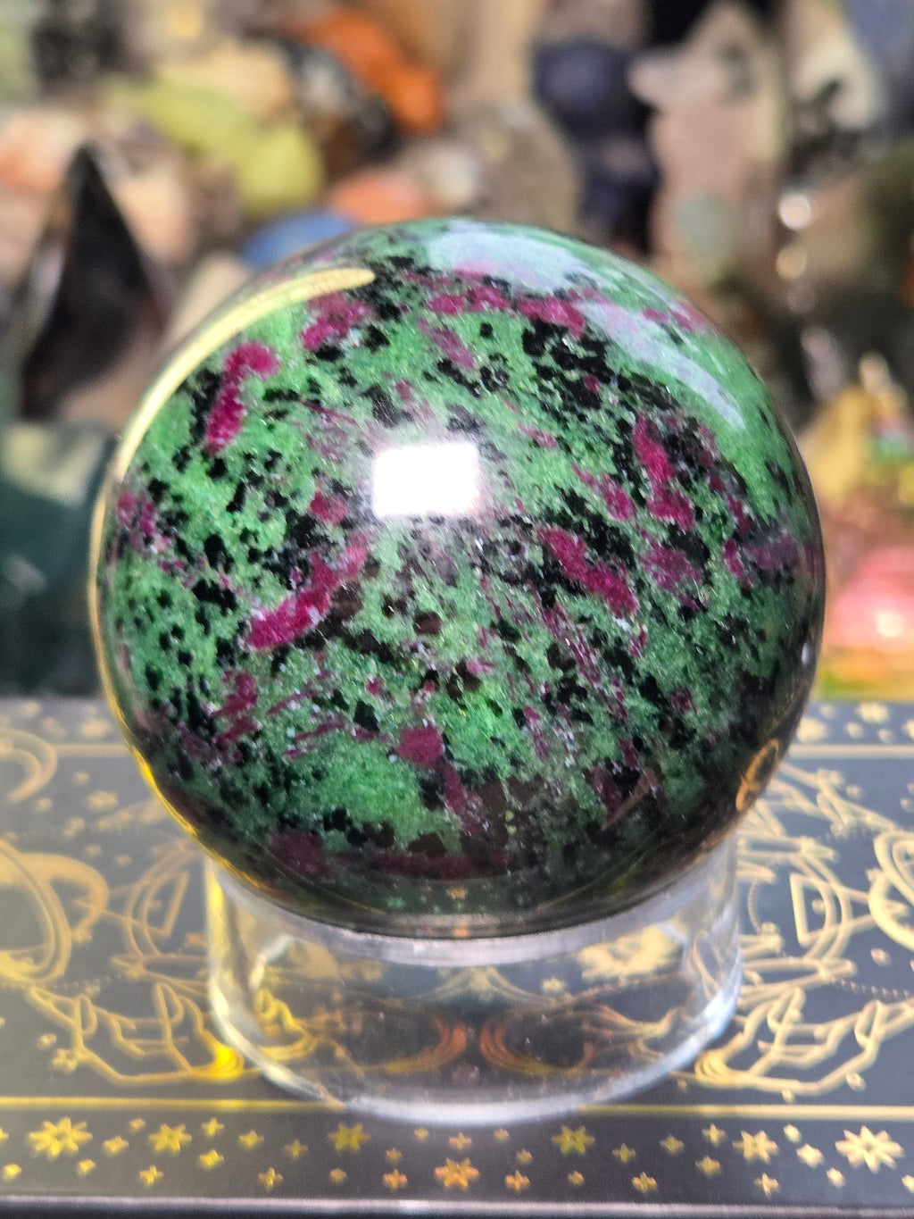 Ruby in zoisite crystal sphere carving