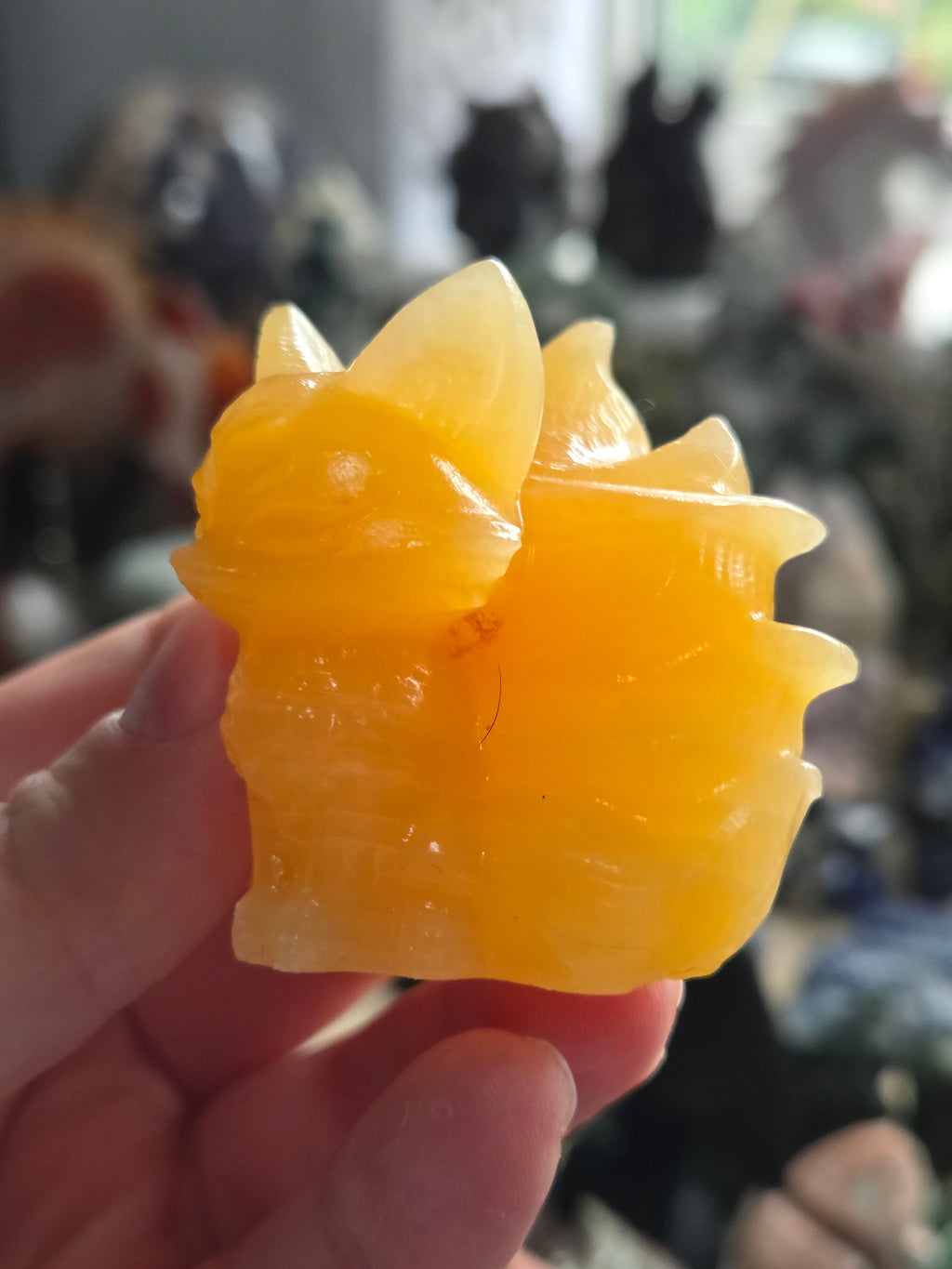 Orange calcite crystal nine tail fox