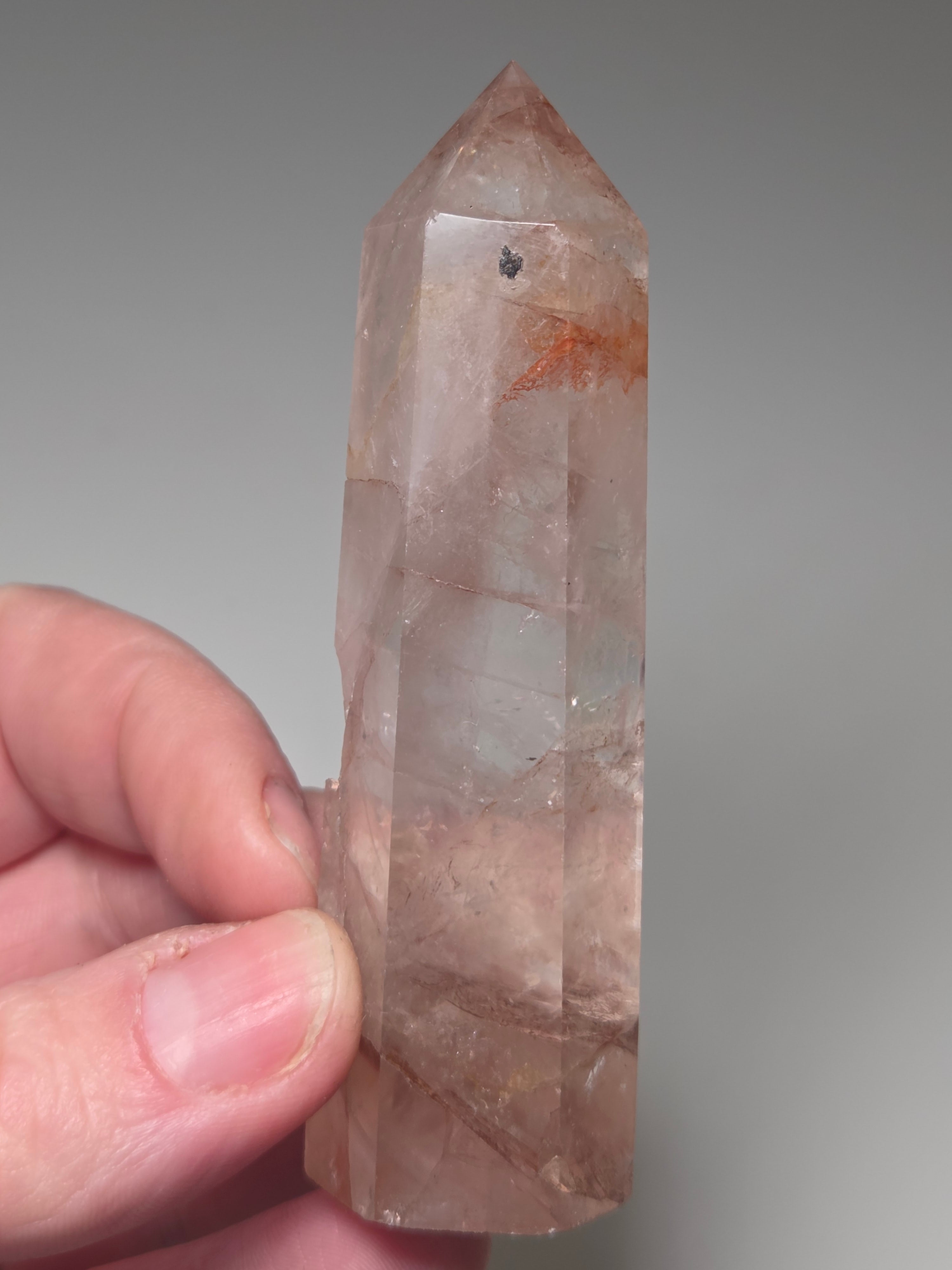 Fire quartz crystal tower with imperfections